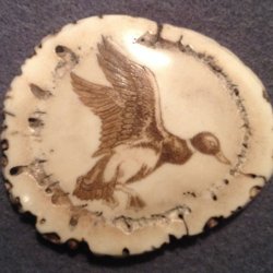 Carved/ scrimshawed antler art piece